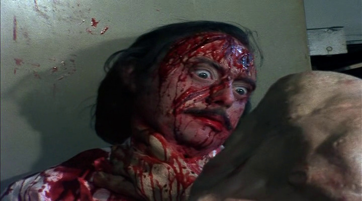 Dr. Needleman meets his end covered in blood and screaming.