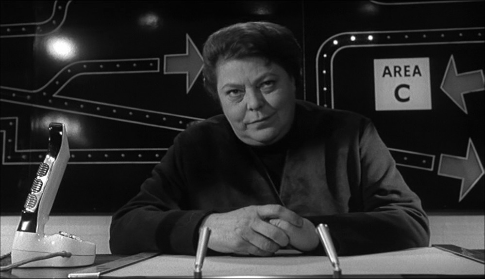 Dr Crow, the Bond-style villain, looking evil and androgynous.