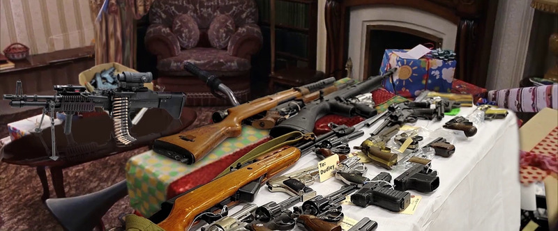 A table full of guns.
