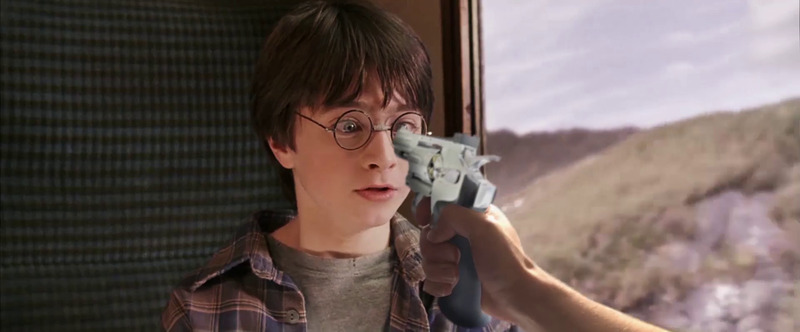 Harry with a gun in his face.