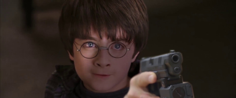 Harry holding a gun.