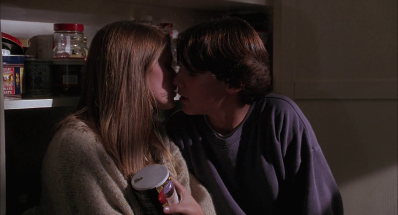 The two teenage protagonists kiss (almost).