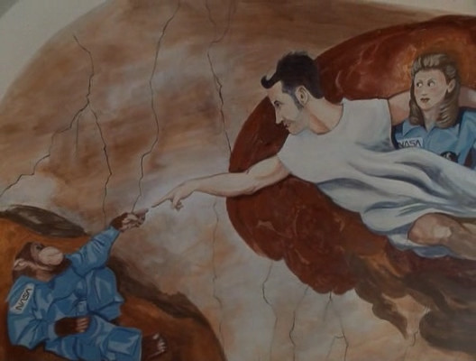 A painting of Randall as God on the ceiling of the Sistine Chapel.